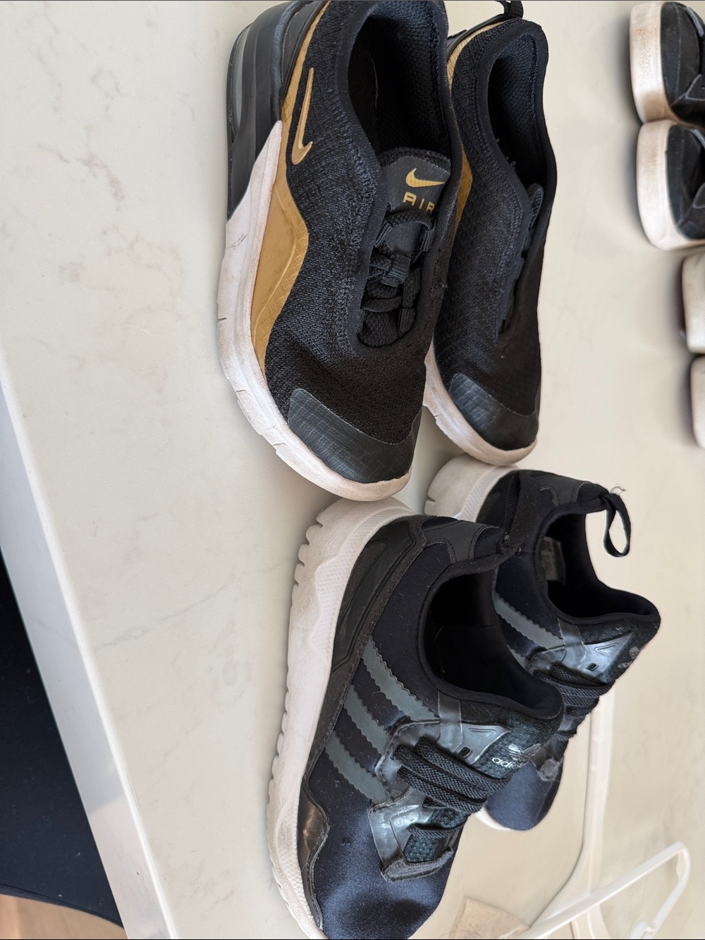 Nike Black and Gold Slip-On Athletic Sneakers